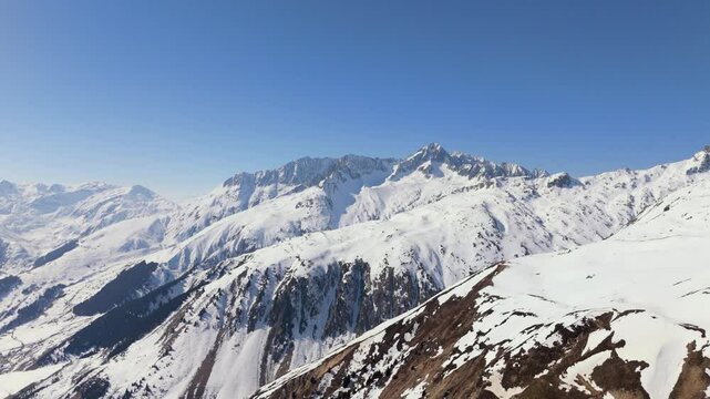 Drone Footage flying from Disentis-Sedrun Cuolm da Vi towards Piz Nair