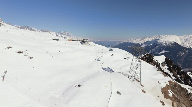 Cuolm da Vi Gondola from Sedrun to Disentis descendig, approaching a tower