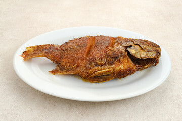 Grilled Tilapia with honey and soy sauce or Ikan Nila Bakar. 
