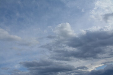 Fototapeta premium Beautiful sky with white and grey clouds