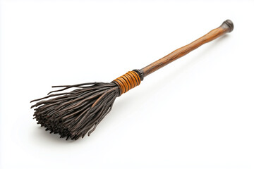 A realistic plastic figurine of a Halloween witch's broom, isolated on white background