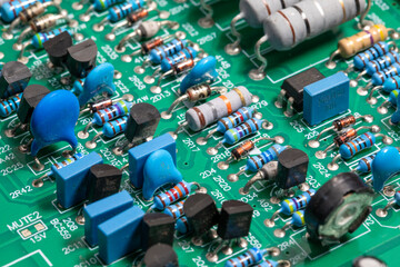Electronic circuit board, transistors, resistors, capacitors, and diodes on the printed of an...