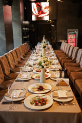 The festive table is set with dishes and utensils.
