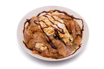Raw, fresh chicken in chicken sauce.
Clipping path included.