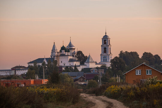Russia. Pereslavl-Zalessky. Nikitsky Monastery and the bell tower of the Church of the Nativity of the Blessed Virgin Mary in the village of Gorodishche. September, early morning.