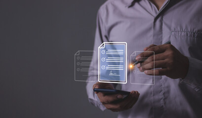 Young man with smartphone mobile hand using a pen touching to sign a Online Business Contract, Electronic signature, Contract signing, Digital documents, Future smart contract