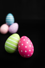 easter egg vertical empty black background copy space template april spring holiday celebration