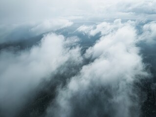 Fototapeta premium Aerial View: Clouds Over Mountain Forest.