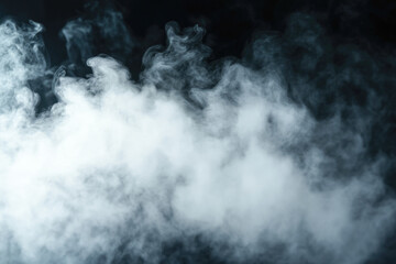 Fototapeta premium Dense white smoke swirling against dark background creating mystical atmosphere