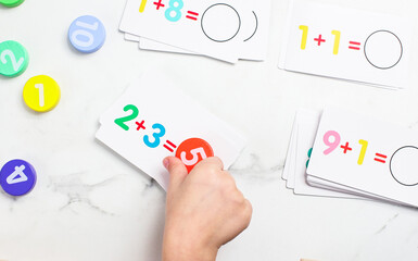 Engaging preschool children in fun mathematics activities using colorful cards and counters for early learning