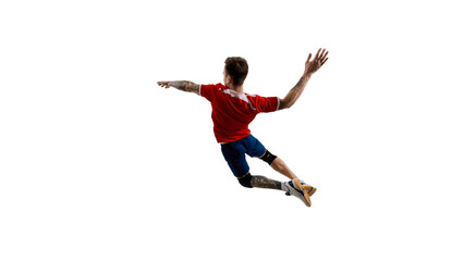 Fototapeta premium Back view dynamic image of young man, volleyball player in red and blue uniform, training against white studio background. Concept of sport, competition, energy, strength, active lifestyle