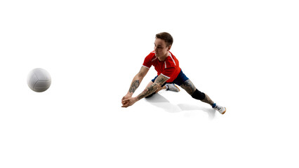 Naklejka premium Dynamic top view image of determined volleyball player in motion playing volleyball against white background. Concept of sport, competition, energy, strength, active lifestyle, determination.