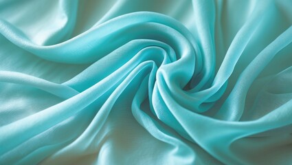 Obraz premium Twisted folds of turquoise blue transparent fabric; wave (macro, texture).