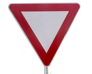 Triangular Yield road sign. It points downward with a thick red border and white background.