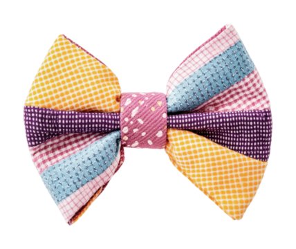 Colorful fabric bow with polka dots and stripes on black background, cut out