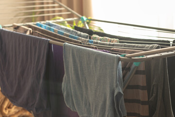 Drying laundry on a drying rack at home