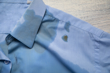 Brown coffee spilled on shirt. Daily lifestyle concept