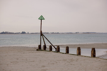 Coastal navigation marker on beach, minimal seaside landscape