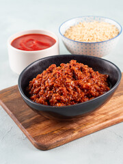 Vegan tomato bolognese ragu with soya protein granules in bowl