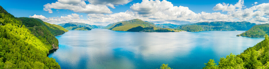 Panoramic view from above of the fjord with beautiful sky. View of Sandsfjord (Sandsfjorden) near Eide and Sand villages in municipality of Suldal in Rogaland county, Norway. Horizontal banner