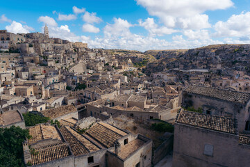 View of the scenic old town with beautiful stone buildings and medieval rooftops under sunlight, Matera, Basilicata, Italy.