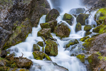 View of breathtaking waterfall cascading through a gorge in an alpine landscape, Hieflau, Styria, Austria.