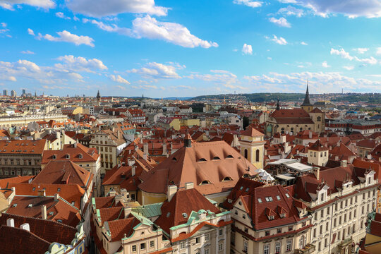 Fototapeta View of beautiful historic architecture and red rooftops at sunrise, Prague, Czech Republic.