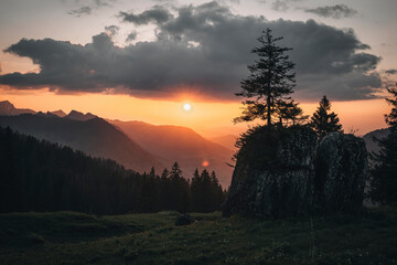 View of a beautiful sunset over majestic mountains and tranquil forests, Alt St Johann, St Gallen, Switzerland.