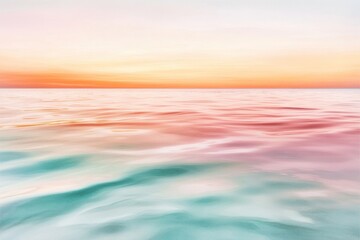 Fototapeta premium A tranquil ocean scene at sunset, with the sky reflecting on the calm waters in shades of gold and lavender