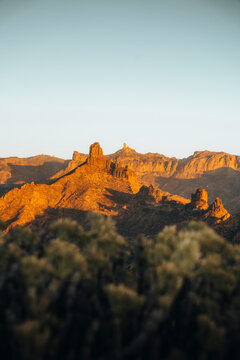 View of majestic rock formations and a breathtaking sunset over the mountainous landscape, Rocco Noublo, Gran Canaria, Spain.