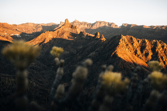 View of majestic rock formations and cacti under a breathtaking sunset in Gran Canaria, Rocco Noublo, Spain.