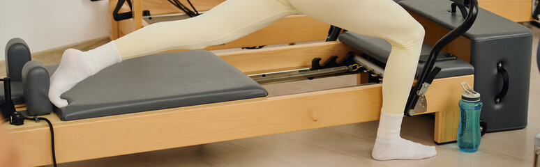 Elevating fitness through dynamic pilates exercises in a modern studio environment