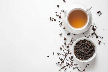 White background with a teapot and tea leaves, a flat lay, top view