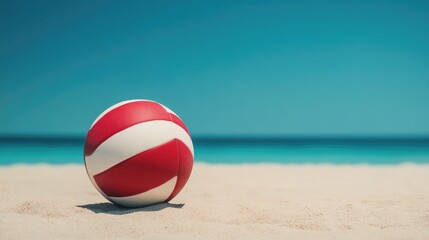 Vibrant red and white volleyball on a serene sandy beach with picturesque azure sky and calm ocean waves in the background  A casual and fun summer recreation scene at a tropical paradise
