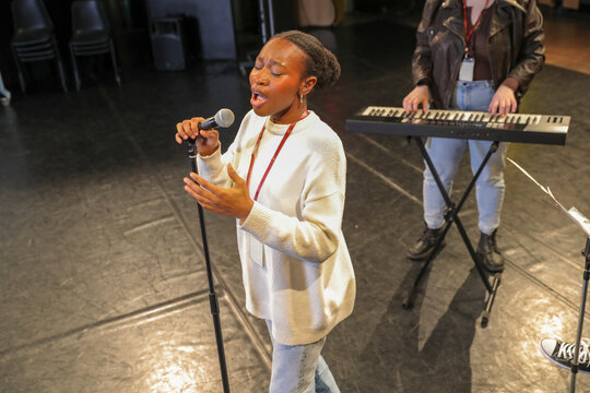 Persons with disabilities performing music on stage