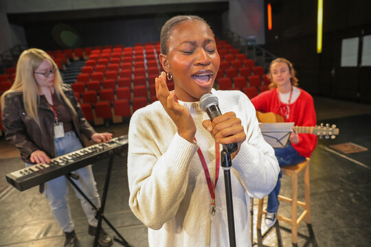 Persons with disabilities performing music on stage