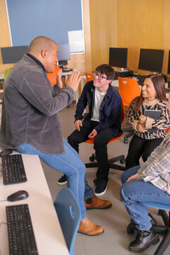 Teacher and students with disabilities at university