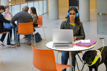 Student with guide dog at university