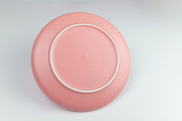 Pink round empty porcelain plate
