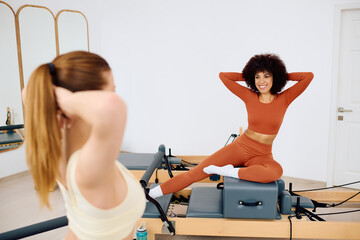 Engaging pilates session in a bright and airy studio with enthusiastic participants