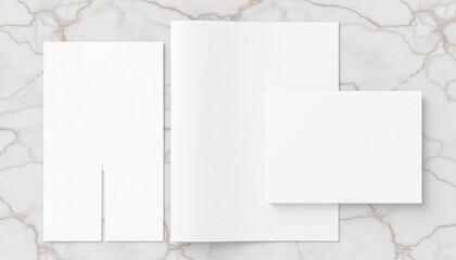 "Minimalist portfolio mockup with a set of blank print designs, neatly arranged on a marble surface."