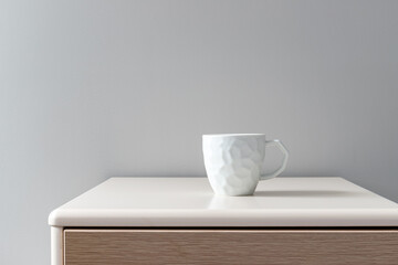 White ceramic water cup on the coffee table indoors