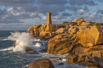 The Ploumanach Lighthouse officially the Mean Ruz Lighthouse located on a cape of pink granite rock located in Perros-Guirec, C&ocirc;tes-d'Armor, France,