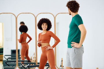 Engaging pilates class in a bright and modern studio with enthusiastic participants