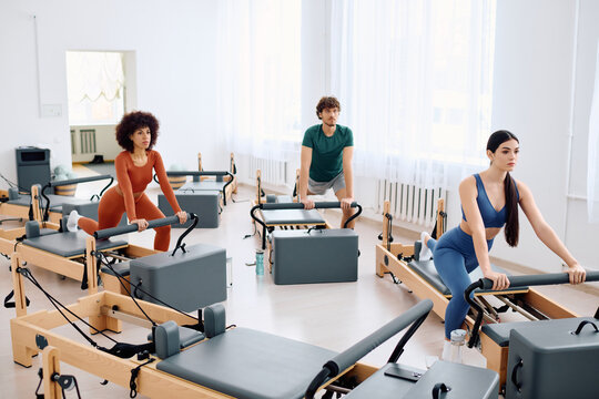 Engaging pilates session at a modern studio with dedicated participants
