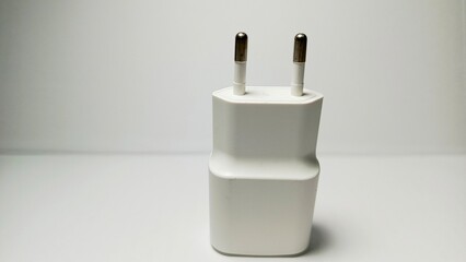 White cellphone charger with white background. technoogy