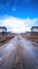 Obraz premium New Residential Street Under Construction: A View of Modern Homes and a Cloudy Sky