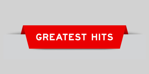 Red color inserted label with word greatest hits on gray background © bankrx