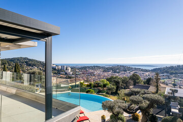 Panoramic sea view with infinity pool and modern glass terrace