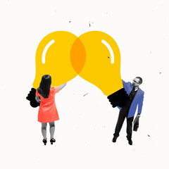 Two business partners connecting lightbulbs, integrating ideas in one common project....